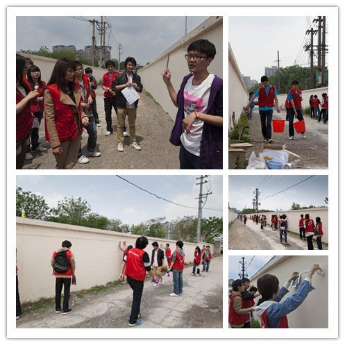 传媒志愿者为民工小学校墙绘制180米“青奥外衣”